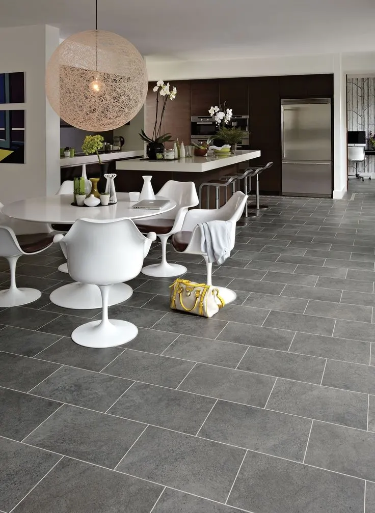 Large-format gray stone floor tiles in a Glenview dining room