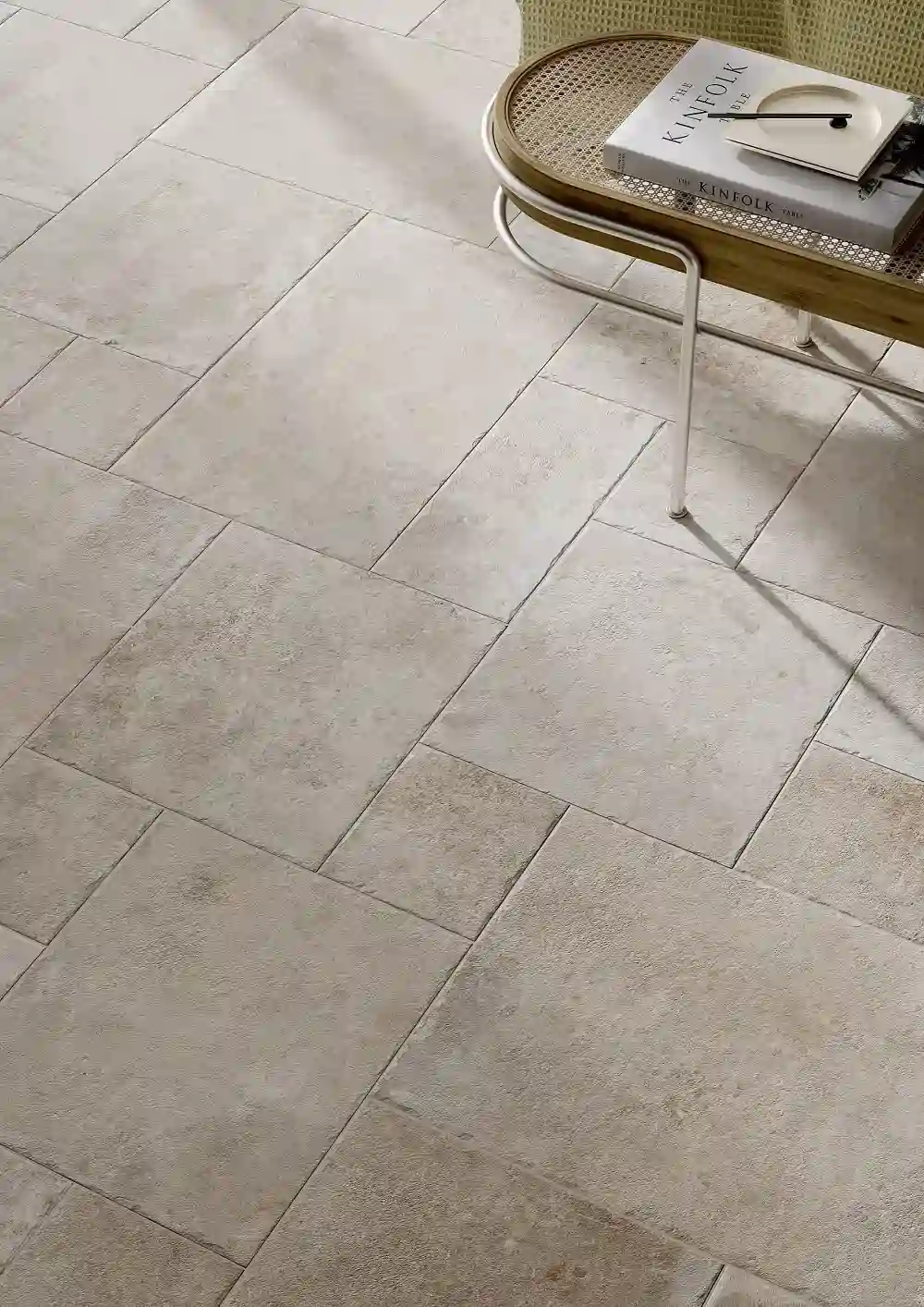 Warm limestone-look floor tiles in a Deerfield foyer